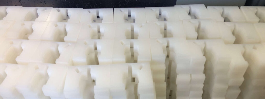 Stacked Plastic Parts from Production Waterjet Cutting Job